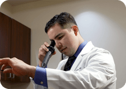 Dr. Rodriguez examining a patient