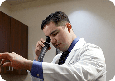 Dr. Rodriguez examining a patient