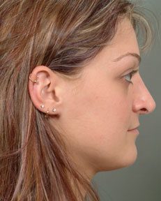 side profile of a woman with earrings