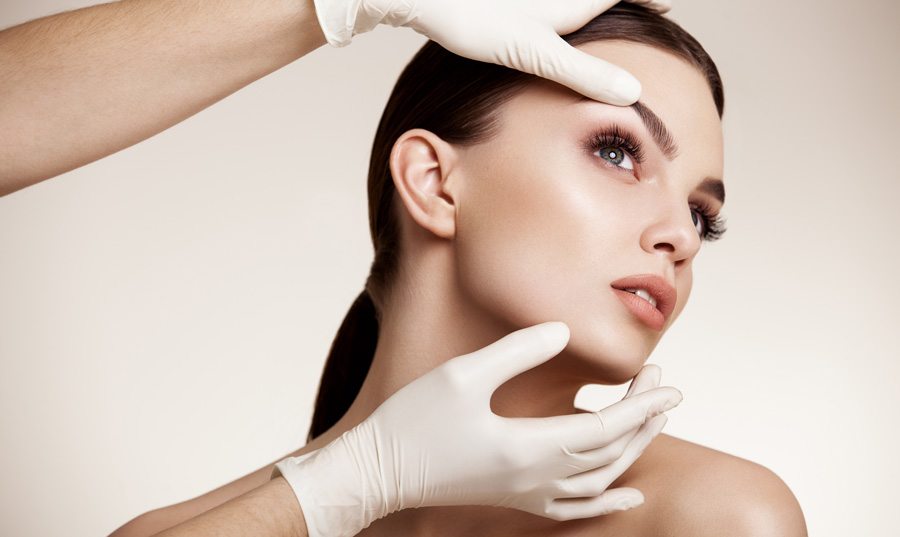 woman having her skin examined