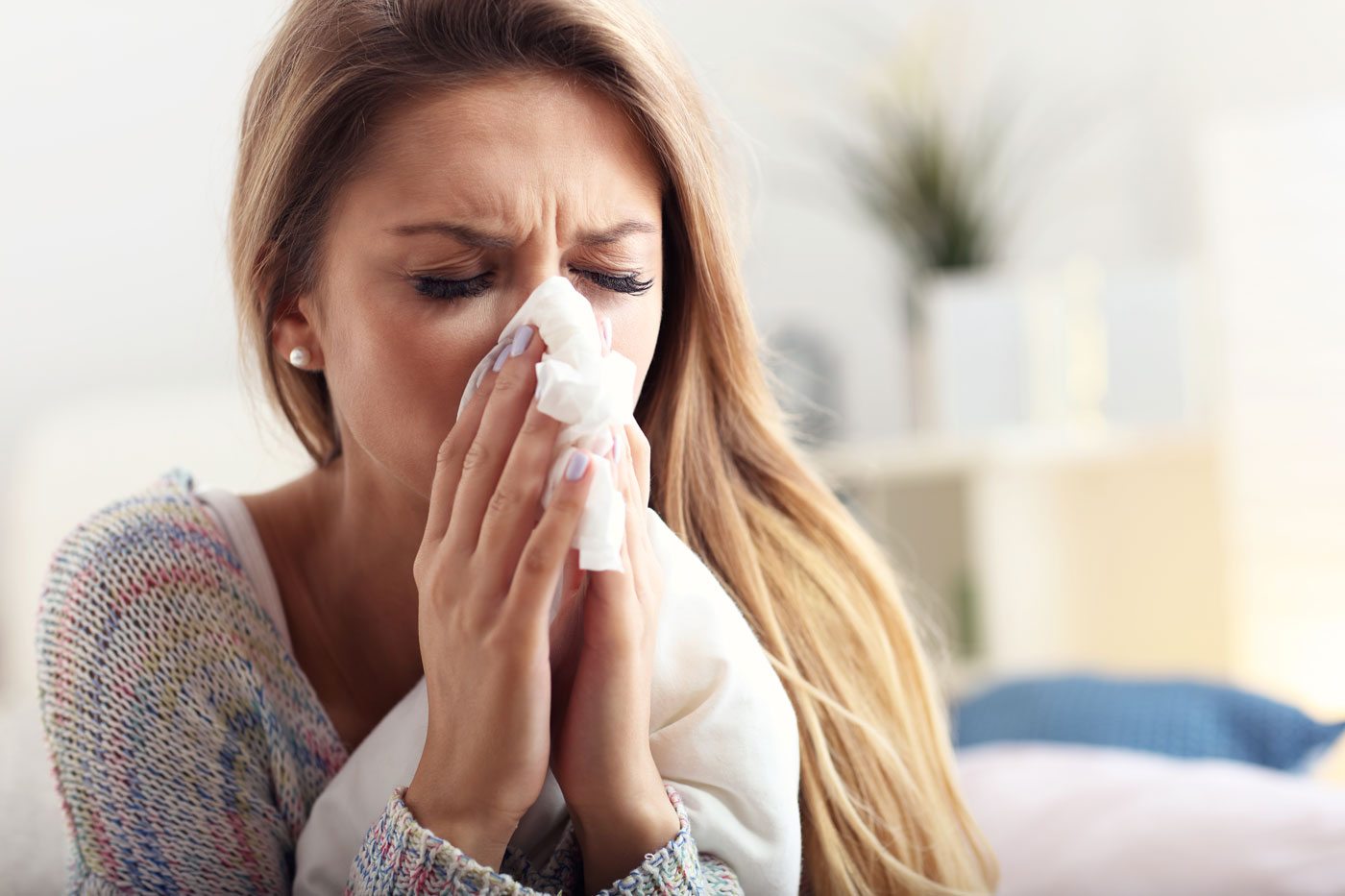Woman Blowing Nose using tissue