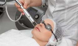 Woman getting facial treatment