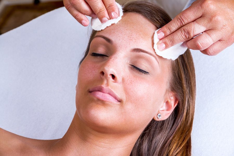 woman receiving facial