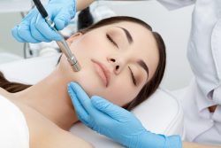 doctor performing microderm on patient