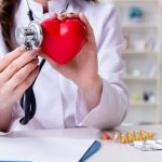 doctor holding heart shaped object