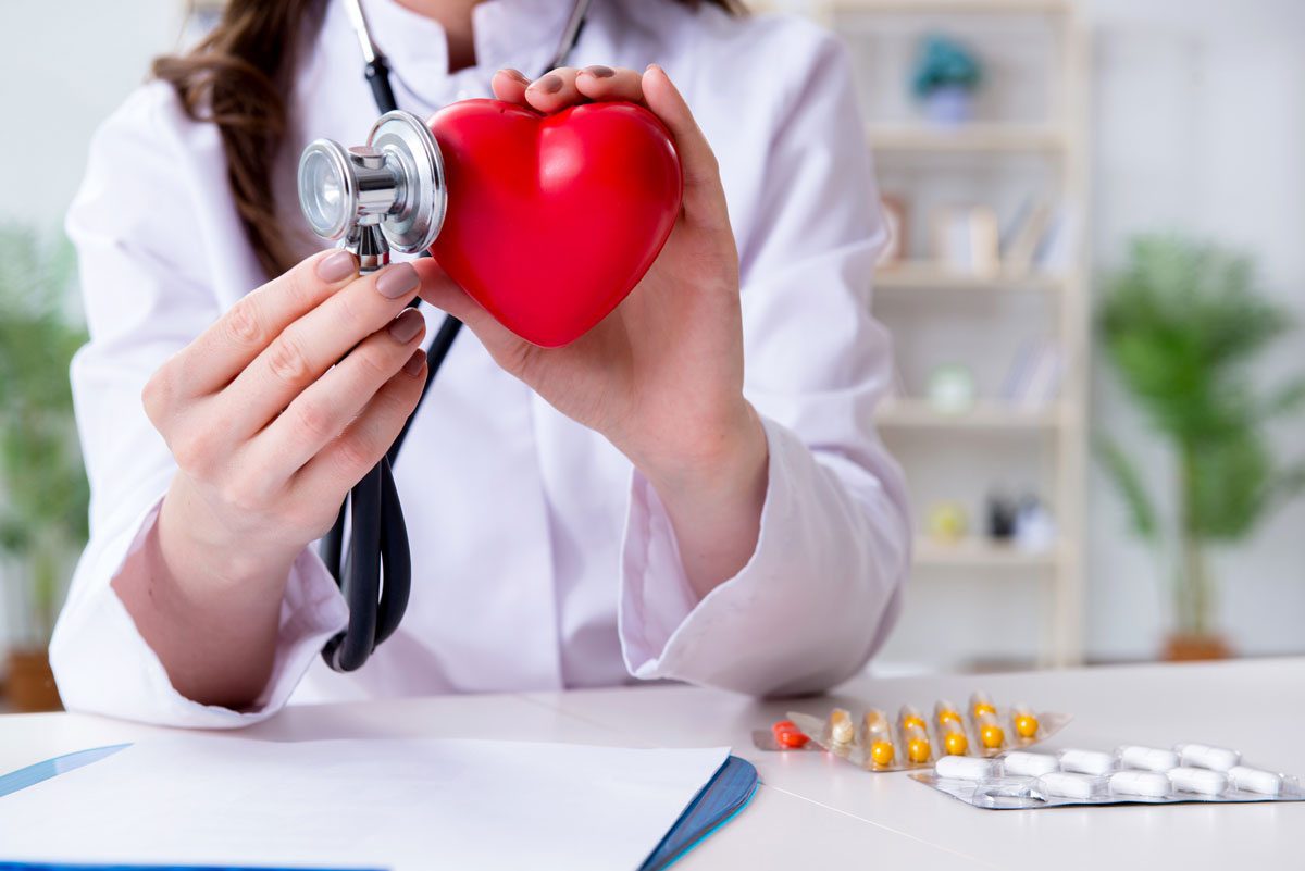doctor holding heart shaped object